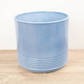 A stunning Munich 'Blue Gloss' Ceramic houseplant pot, admired for its modern pastel colour, gentle curves and distinct 'lined' lower potion that is sure to captivate & inspire! A superb pot that is great for gifting!
