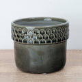 A captivating Zellige Ceramic Grey Plant Pot - admired for their tactile divot arch rims and crackle glaze lower portion.