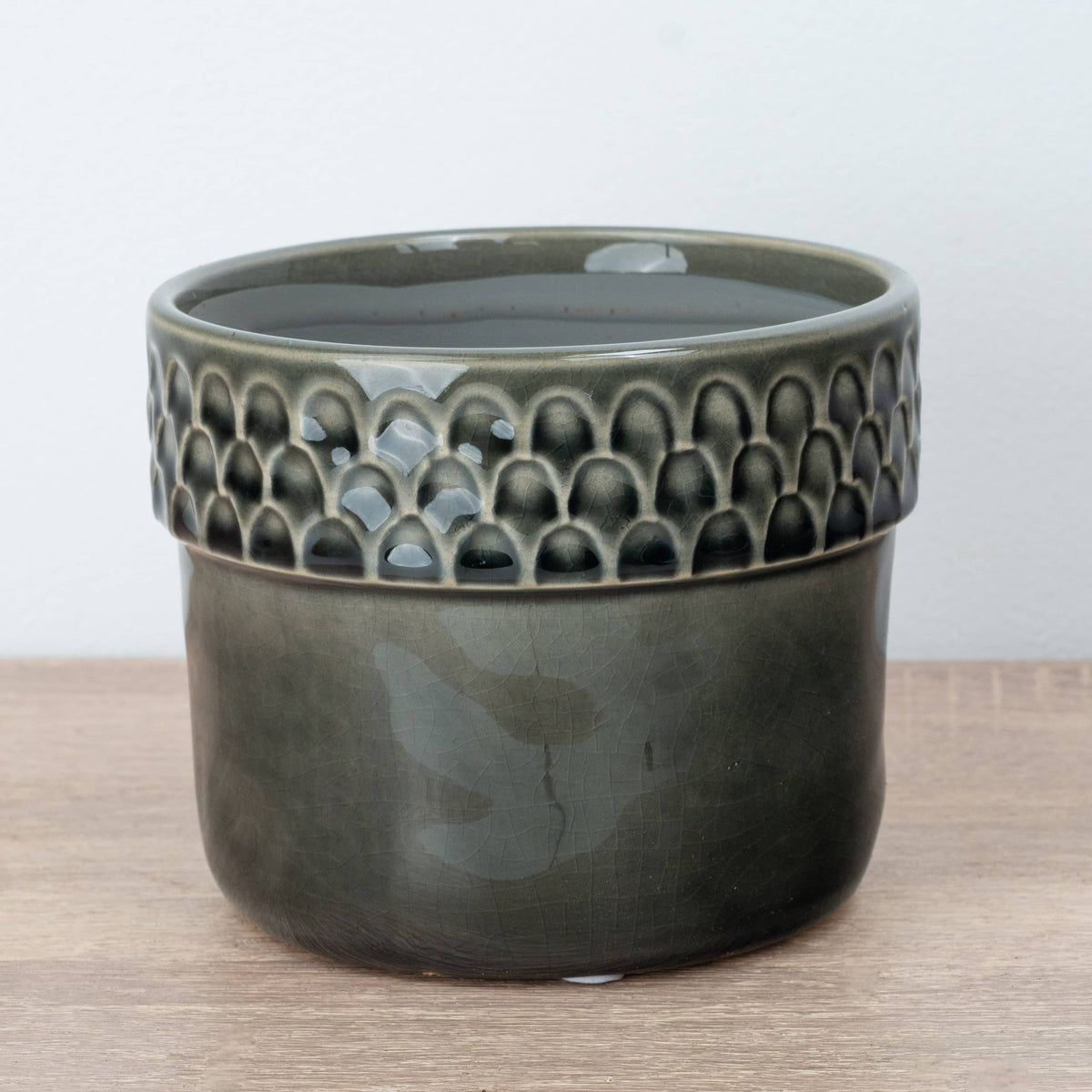 A captivating Zellige Ceramic Grey Plant Pot - admired for their tactile divot arch rims and crackle glaze lower portion.