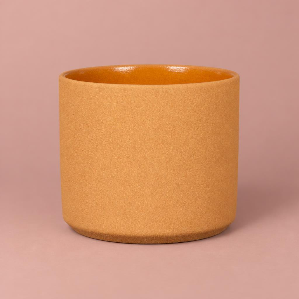 Mondo Yellow Stone plant pot with fine speckling, cylindrical sides and a gently rounded base