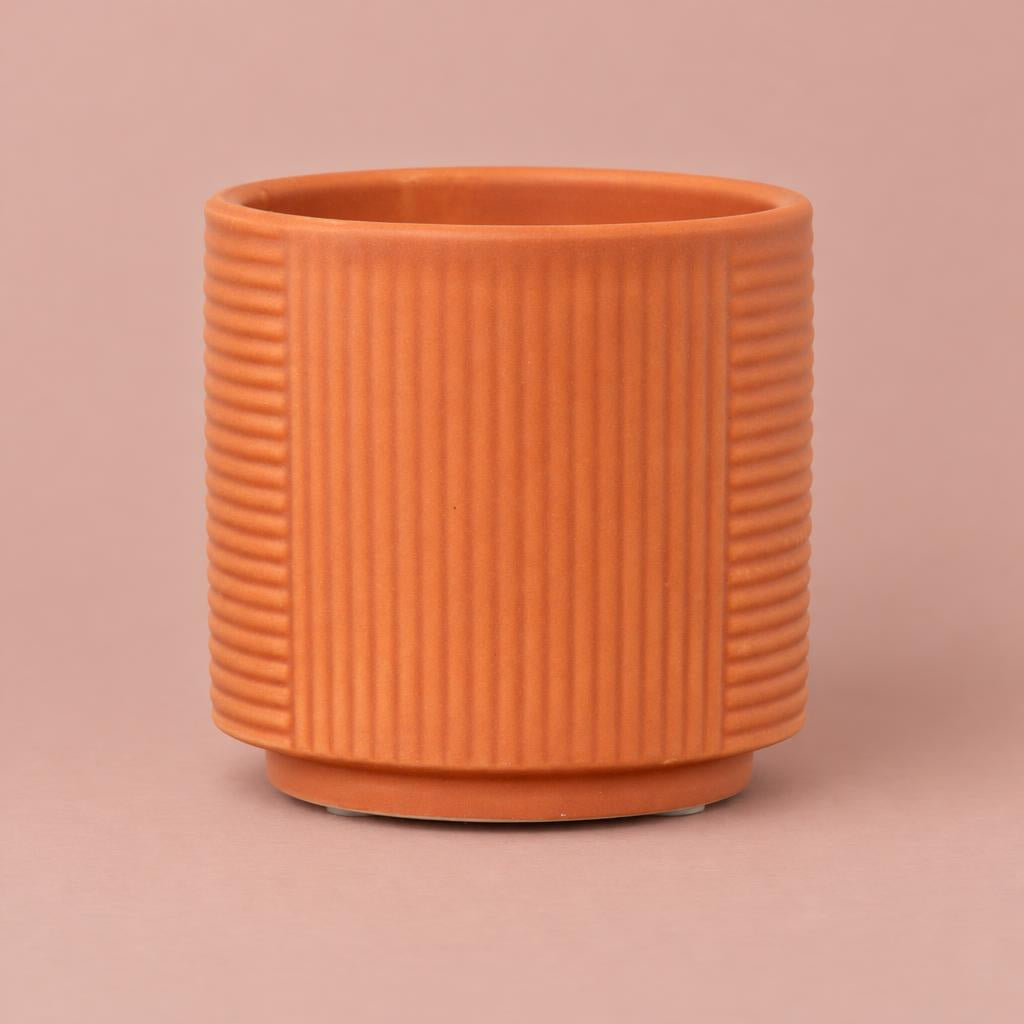Grooves ceramic pot in Tangerine with vertical and horizontal line patterns