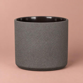 Mondo pot in Basalt Stone with a charcoal-grey speckled finish, dark rim and rounded base