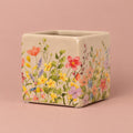 Stone Floral Portuguese Pot with a floral pattern on a soft green background