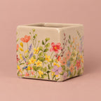 Stone Floral Portuguese Pot with a floral pattern on a soft green background
