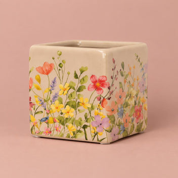 Stone Floral Portuguese Pot with a floral pattern on a soft green background