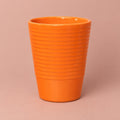 Orange Slimline Ribbed ceramic plant pot with a ribbed surface