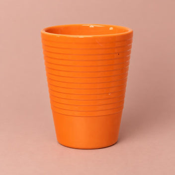 Orange Slimline Ribbed ceramic plant pot with a ribbed surface