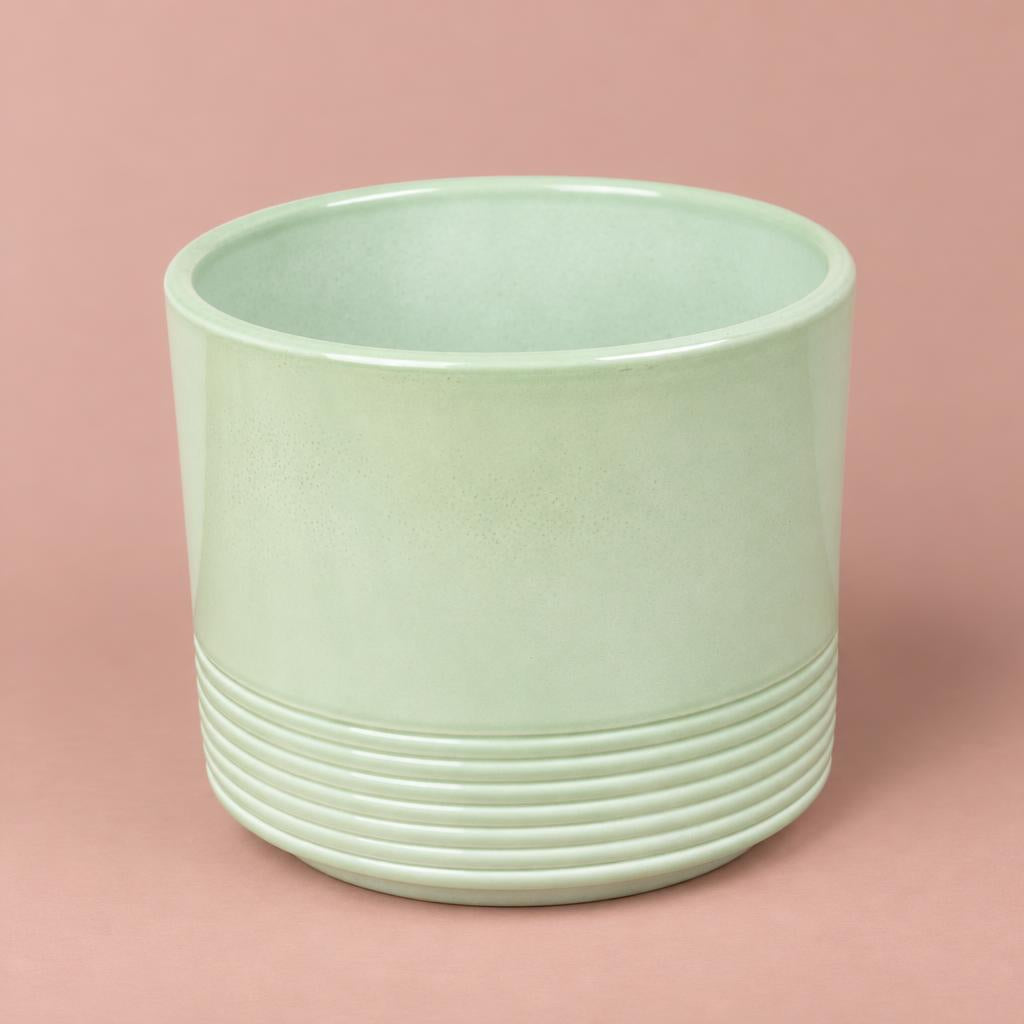 Munich green gloss ceramic pot with curved sides and lined detailing around the lower section