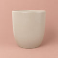 Hugo plant pot in Stone with a tall, rounded shape