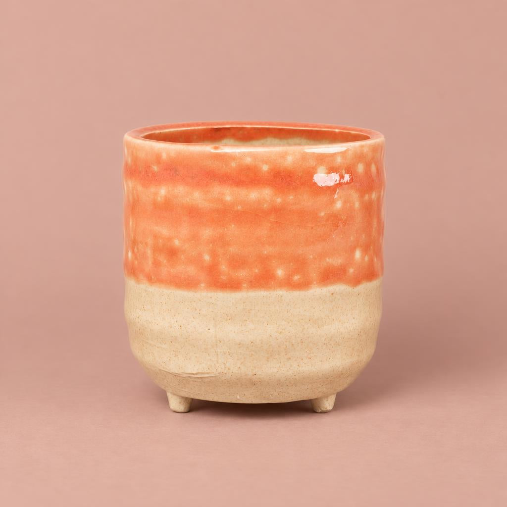 Titan orange reactive glaze plant pot with feet