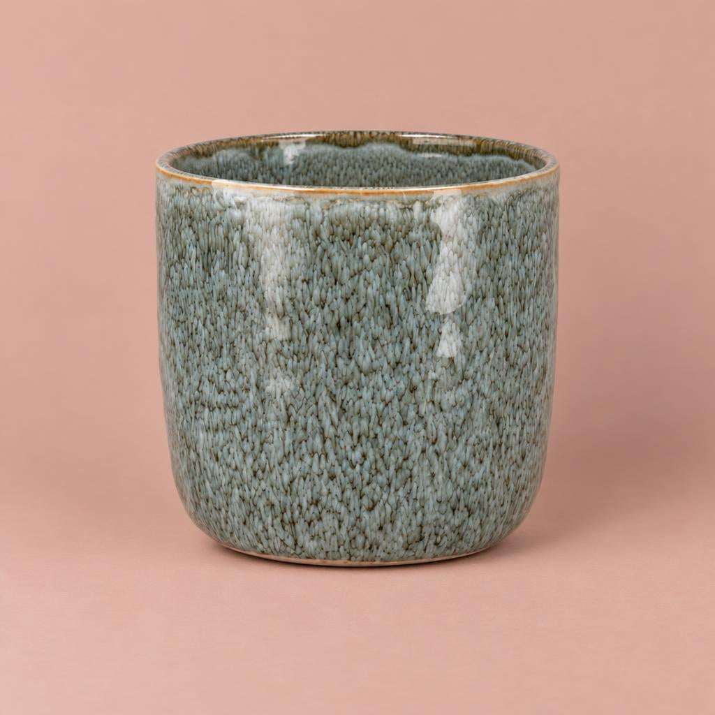 Blue Iron Stone ceramic pot with a mottled glaze, rounded shape and warm-toned rim