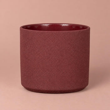 Mondo Burgundy Stone pot with light speckles, a darker rim and a gently rounded base