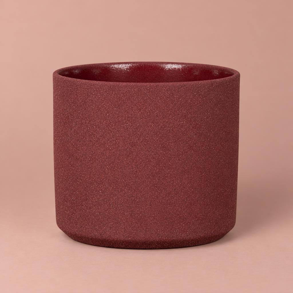 Mondo Burgundy Stone pot with light speckles, a darker rim and a gently rounded base