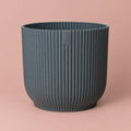Vibes Fold plant pot in Anthracite with a wavy ribbed surface