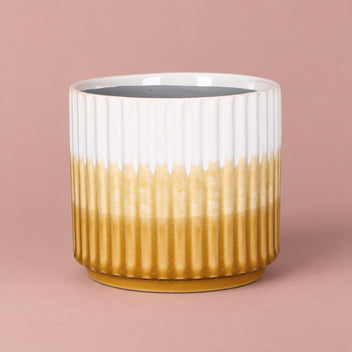 Kiri Pot with vertical ribbing and a glossy glaze graduating from white at the top to yellow at the base