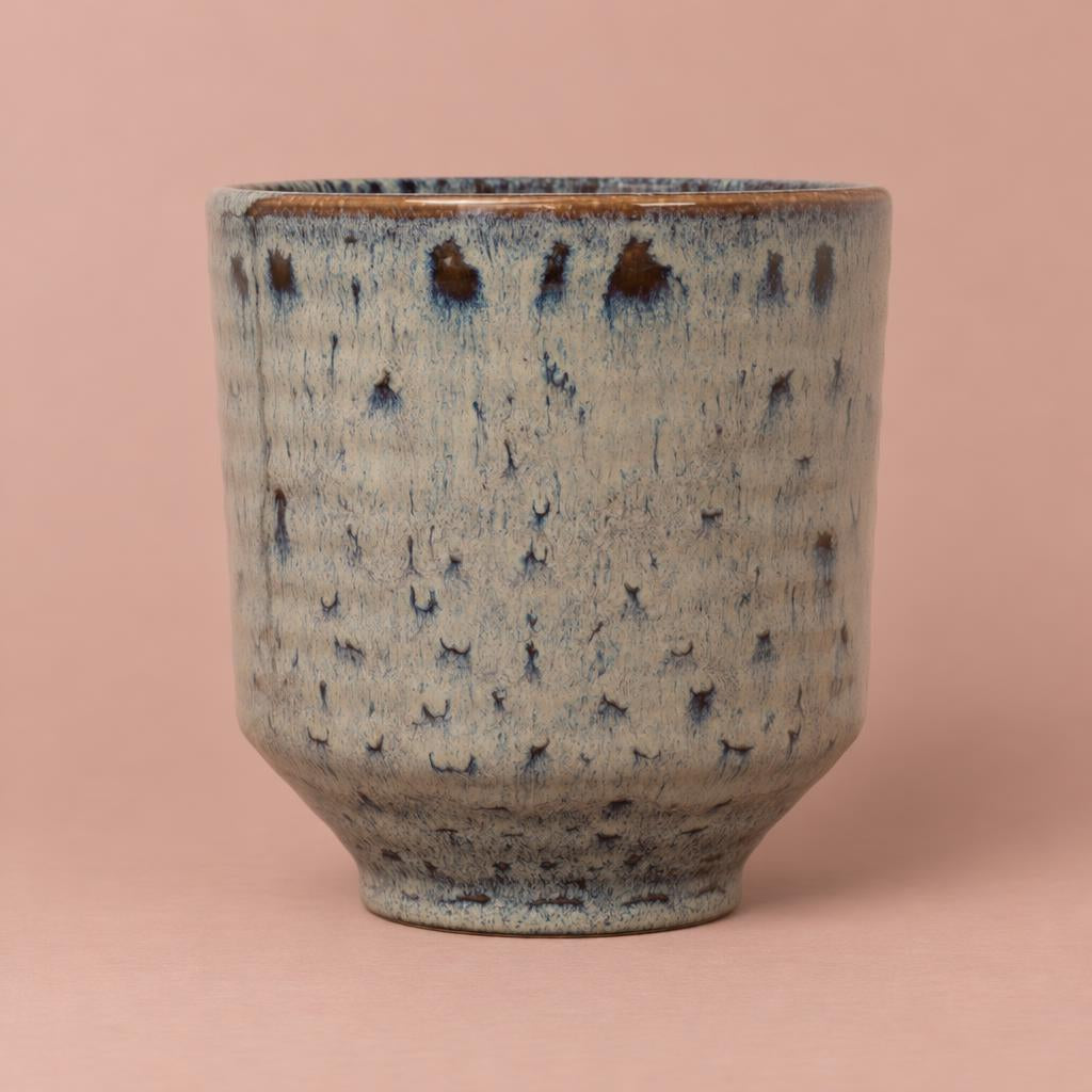 Mocha ceramic orchid pot with a tapered shape and reactive glaze