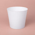 Jemima white plastic plant pot cover with a minimalist design
