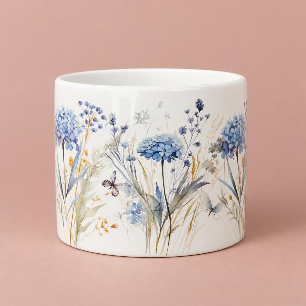 Floral Fiori ceramic pot with a glossy white background and blue hydrangea, foliage and butterfly decoration