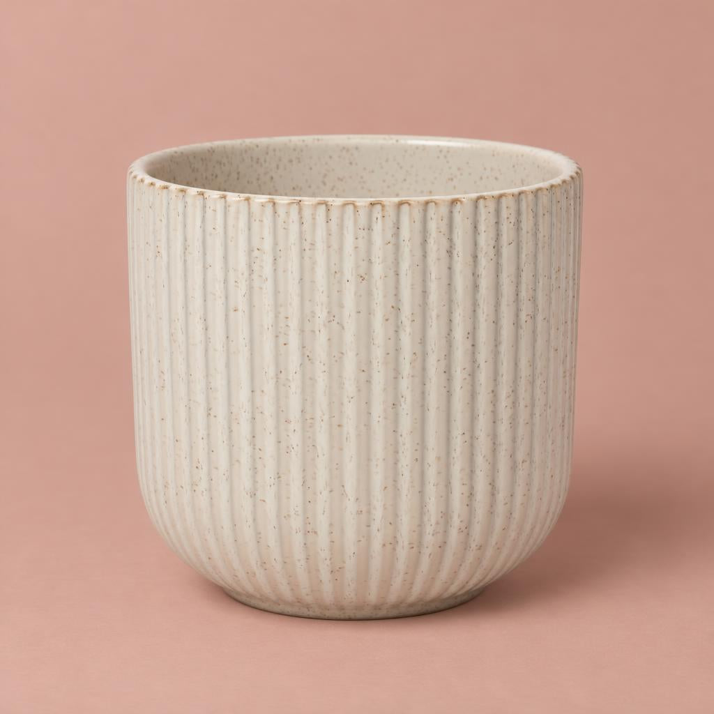 Cream Lodi pot with a rounded shape, fine vertical ribbing and a lightly speckled glaze
