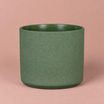 Mondo pot in Moss Stone with pale speckling, a darker rim and a gently rounded base