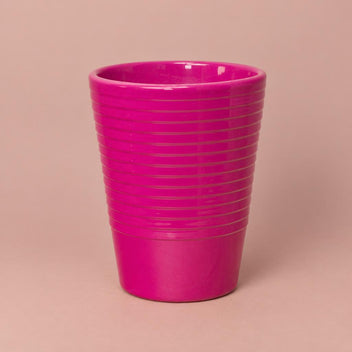 Cerise ceramic plant pot with a slimline shape and ribbed detailing