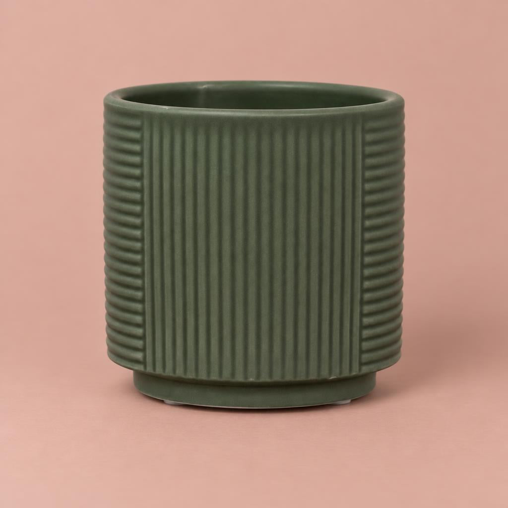 Grooves ceramic pot in moss green with vertical and horizontal line patterns