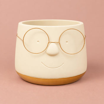 Gold Happy plant pot with glasses detail