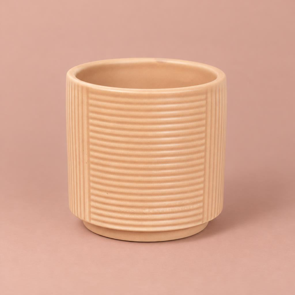 Nude Grooves ceramic pot with creamy-gold colouring and vertical and horizontal line patterns