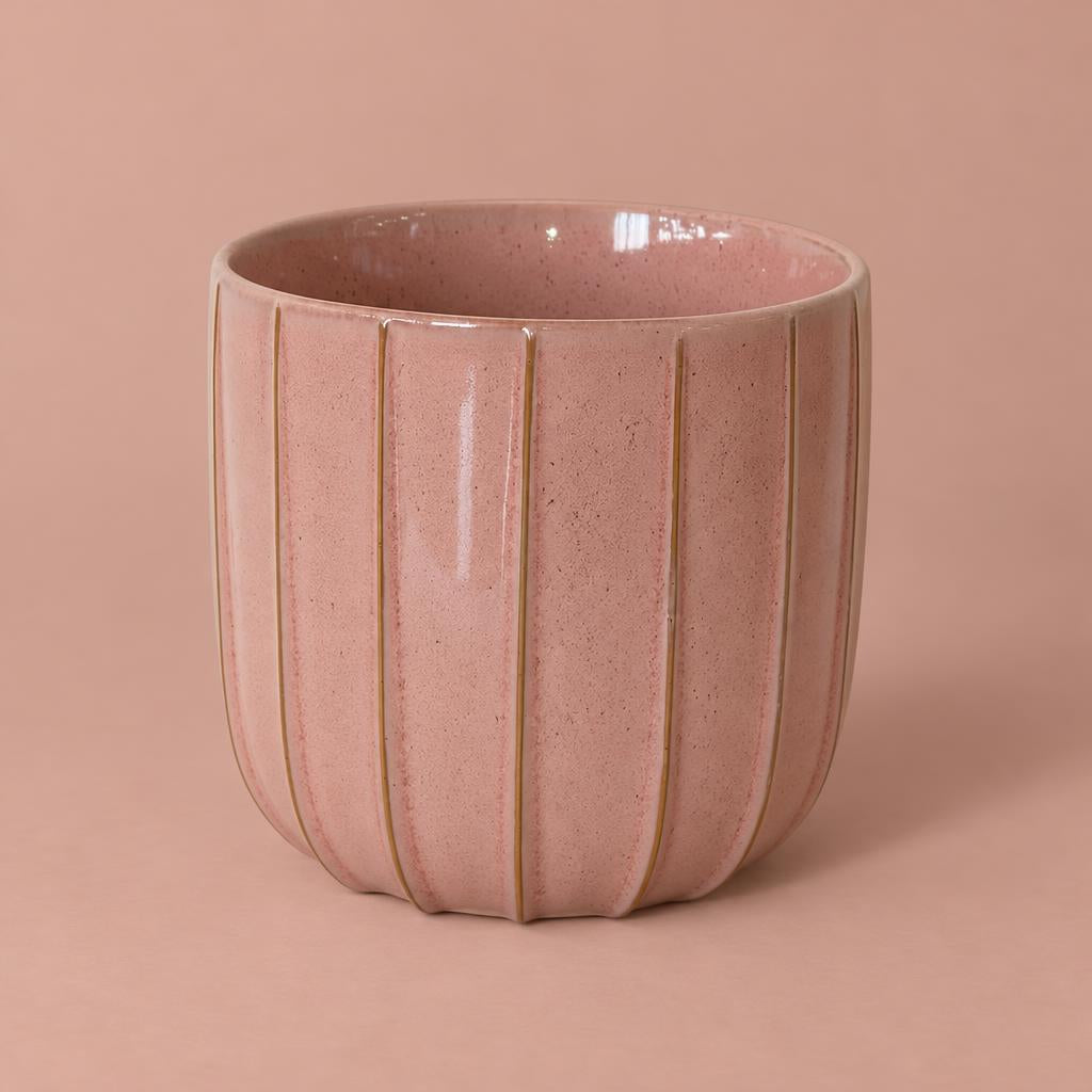Pink Jax pot with a rounded shape, raised vertical fluting and glossy glaze