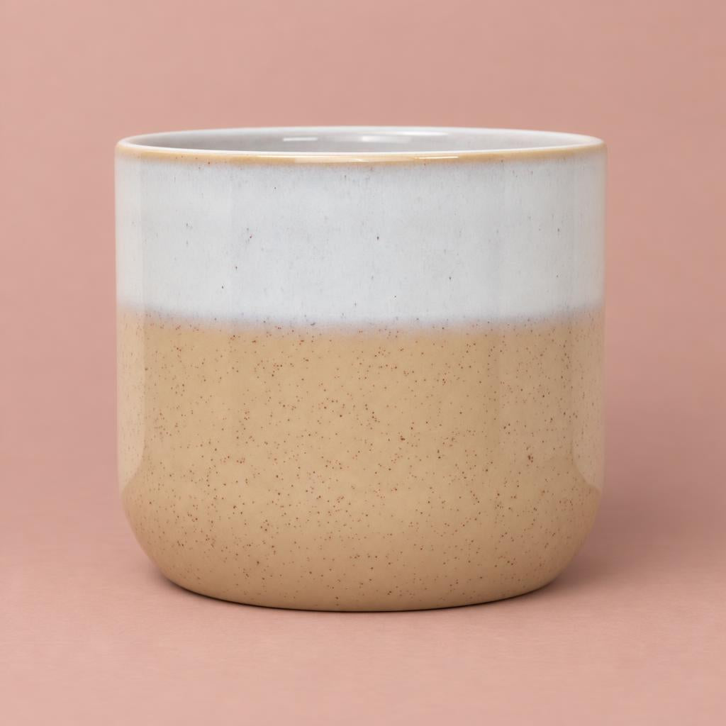 Jodie ceramic pot in sand with a creamy white dipped top