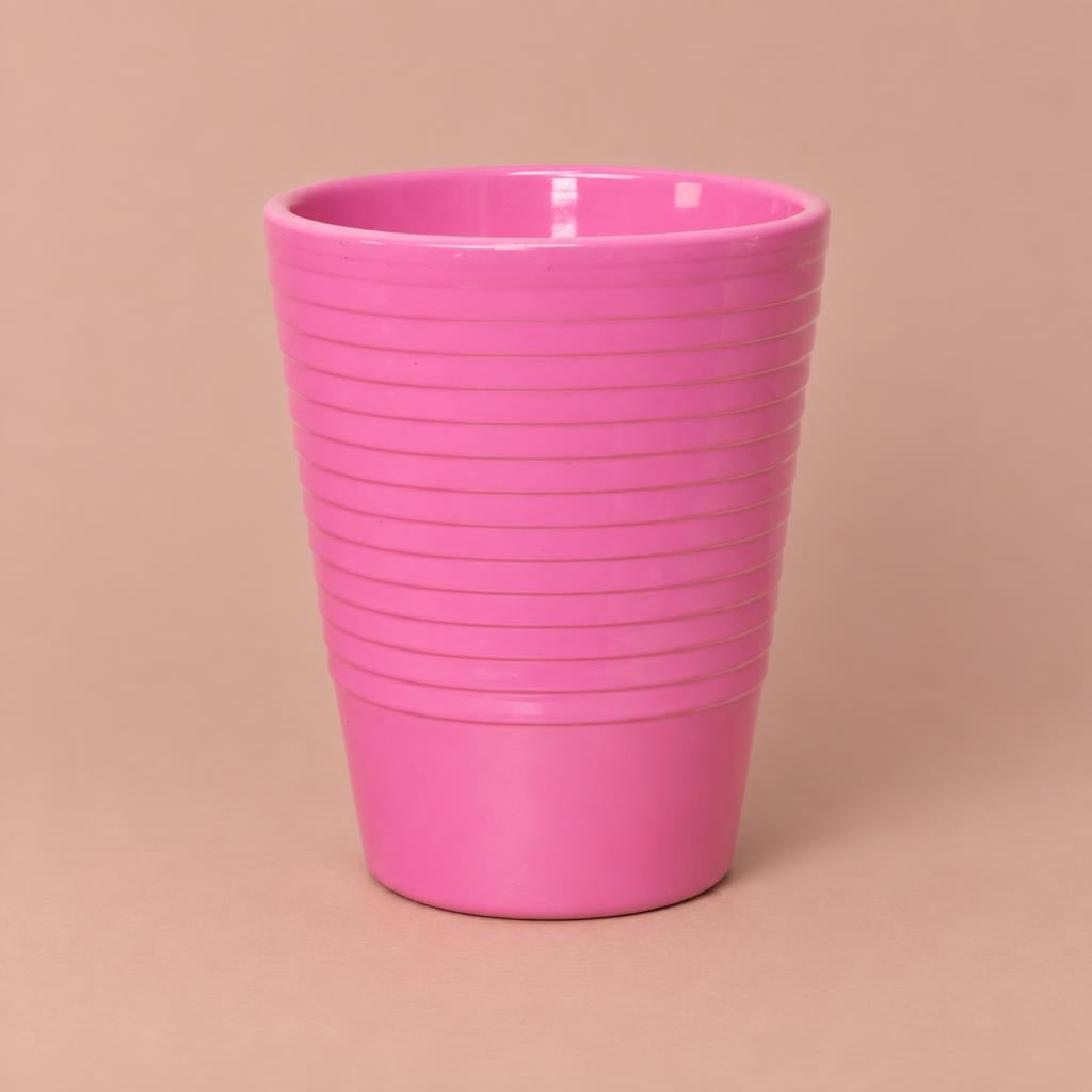 Pink Slimline Ribbed ceramic plant pot with a textured ribbed surface