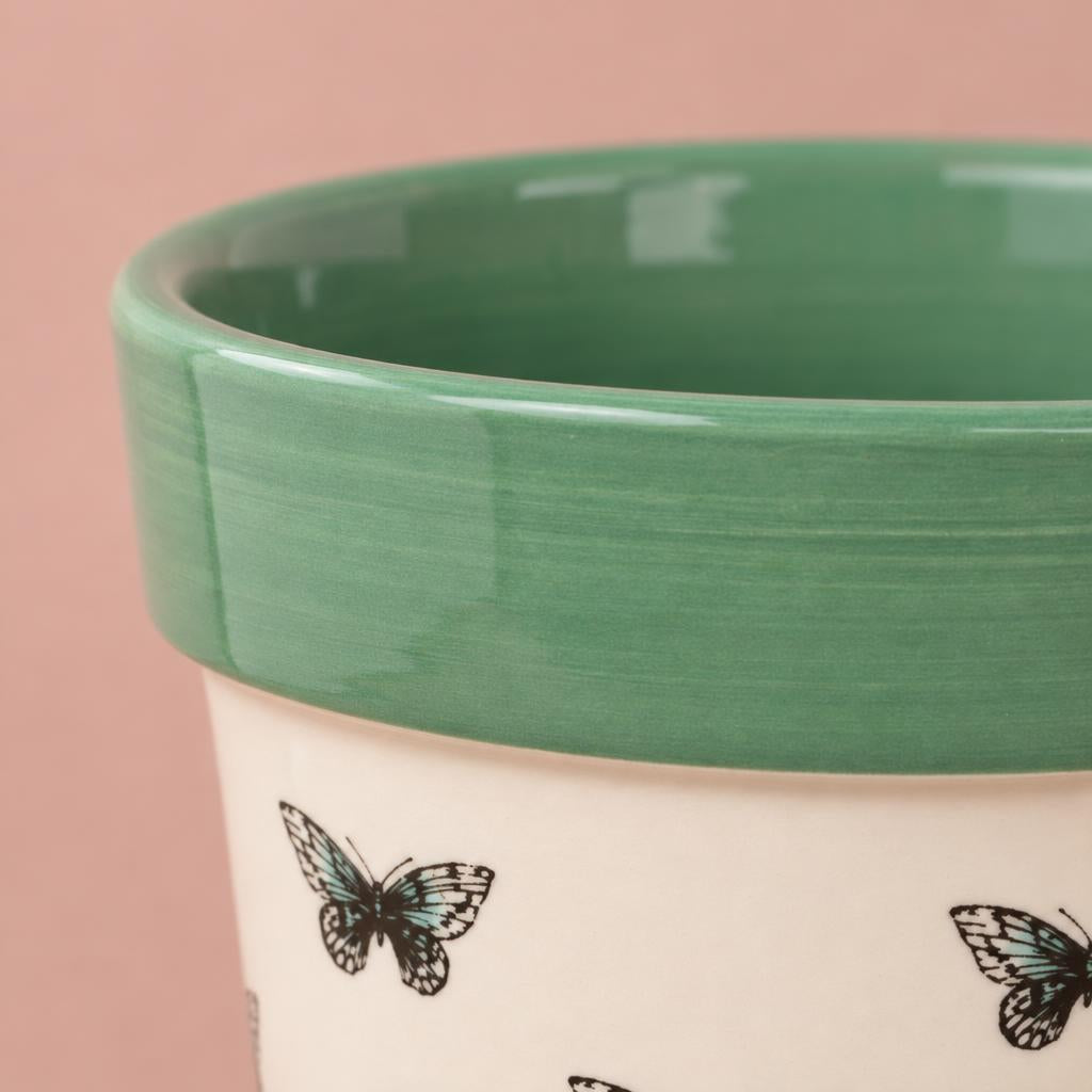 Mint green ceramic pot with pastel butterfly decoration