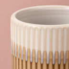 Brown and cream Dinky Dave ceramic pot with a ribbed surface
