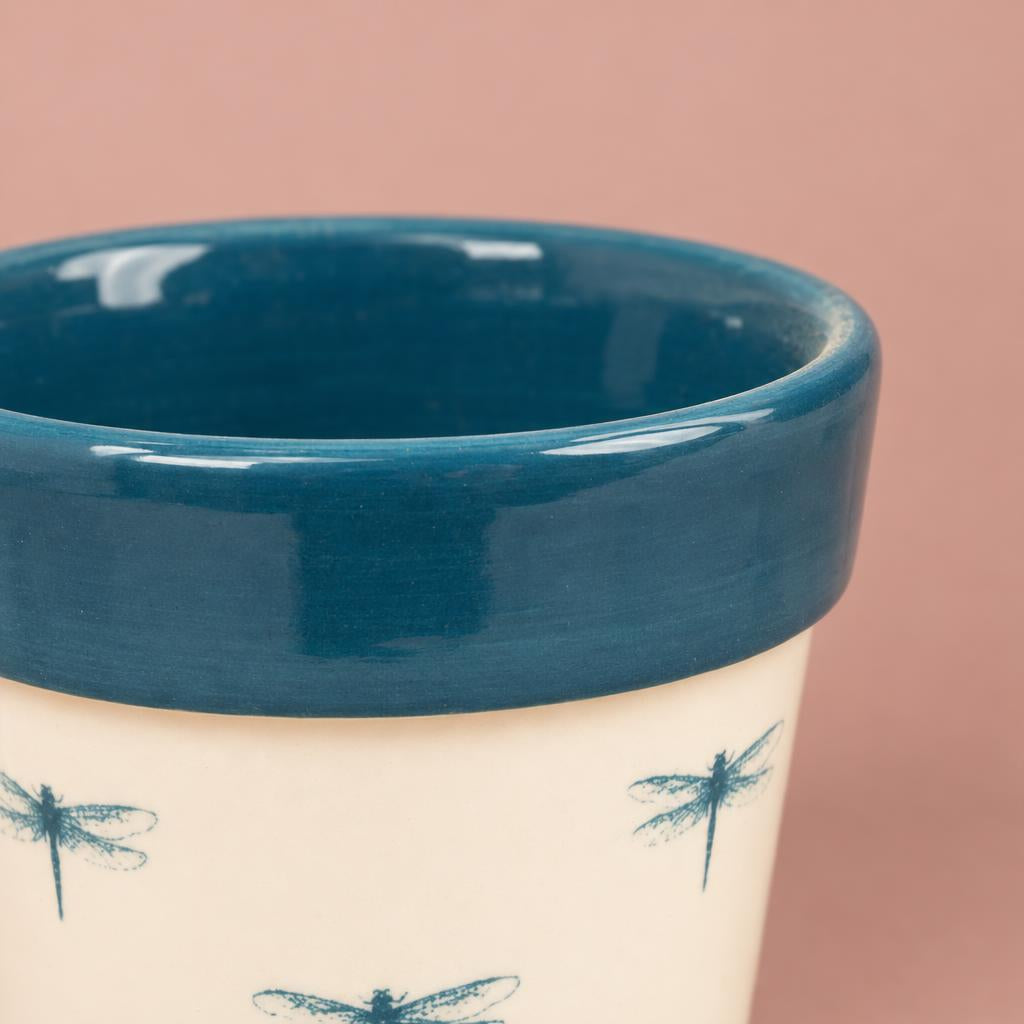 Dragonfly plant pot with dragonfly motifs on a soft white background
