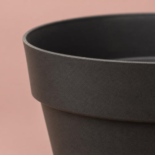 Black acrylic plant pot with a minimalist design