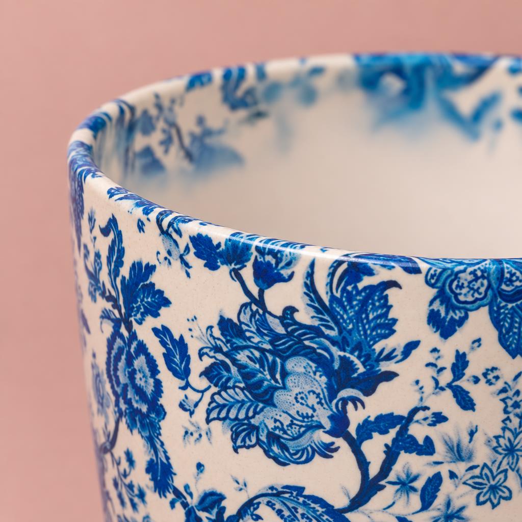 Monza plant pot with a white background and blue floral decoration