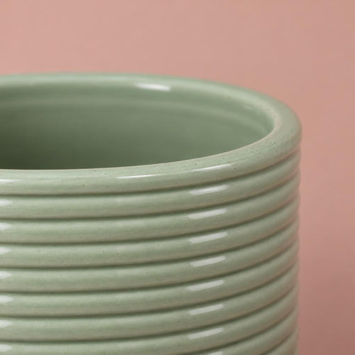 Green Berlin Ripple plant pot with a rounded shape and glazed finish