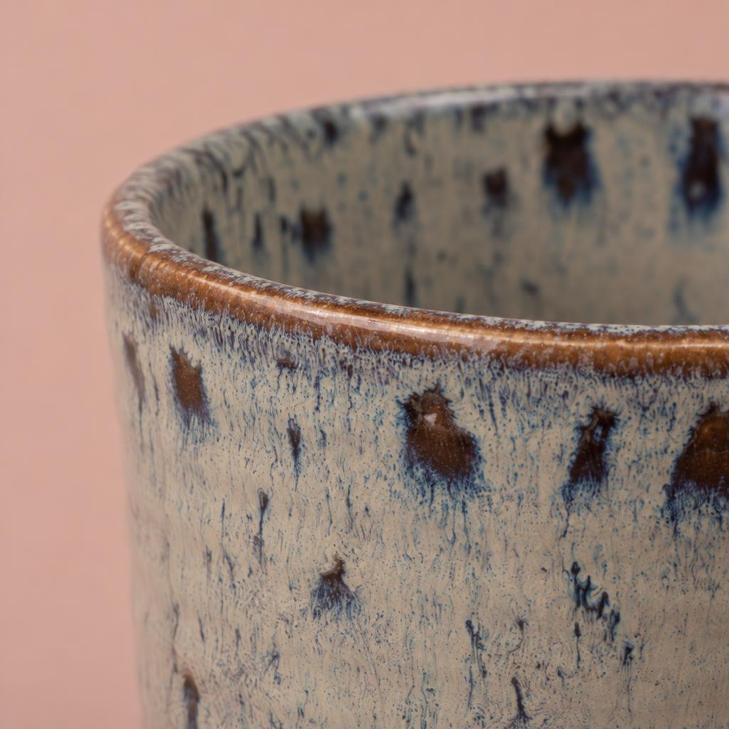 Reactive glaze orchid pot with cream, charcoal and brown dripped colouring