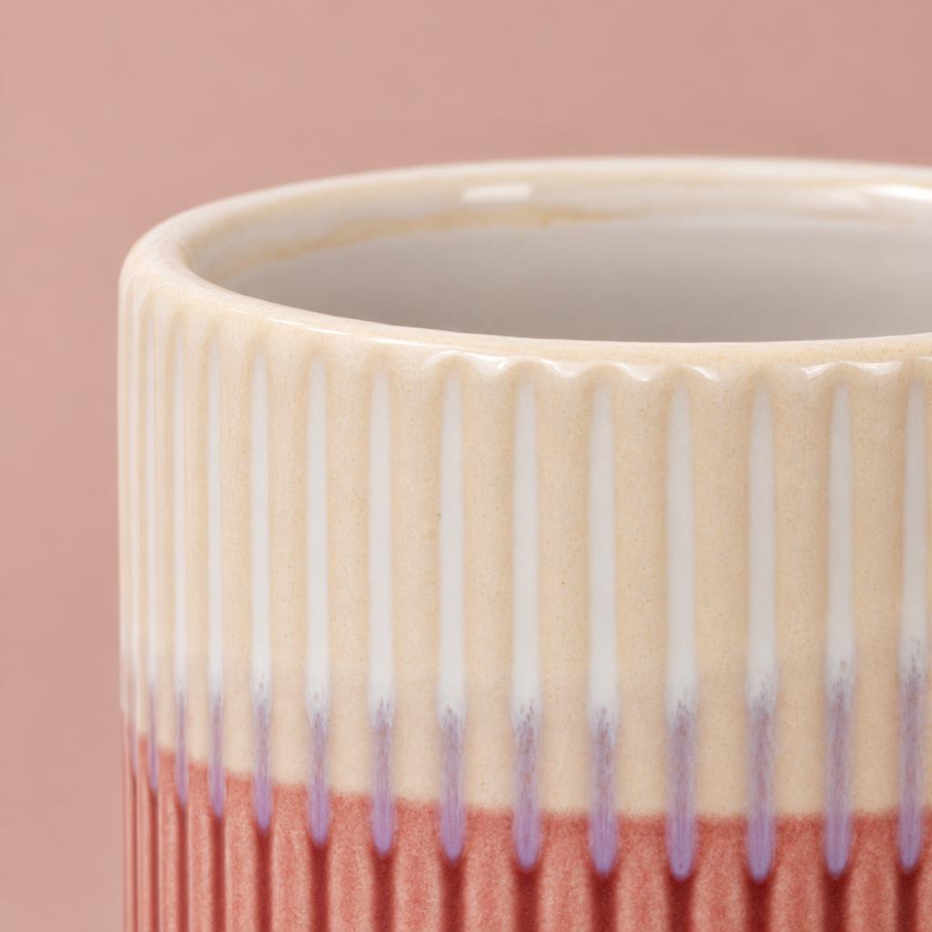 Compact Dinky Dave pot in soft pink and cream with a ribbed texture